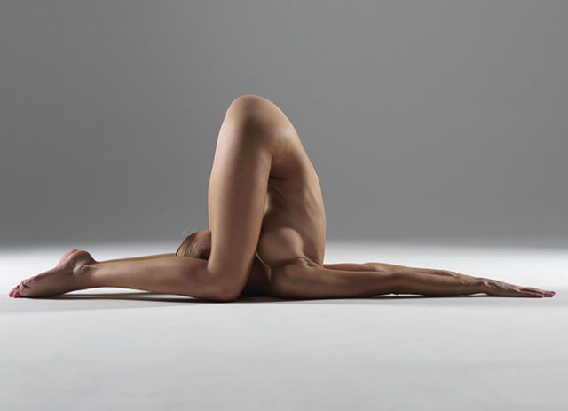 Nude yoga warrior pose
