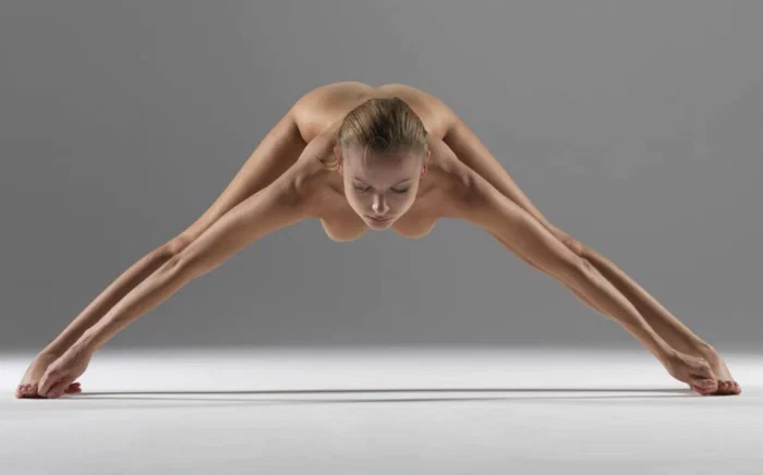 Nude yoga warrior pose