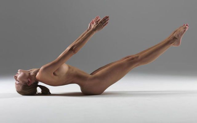 Nude yoga warrior pose